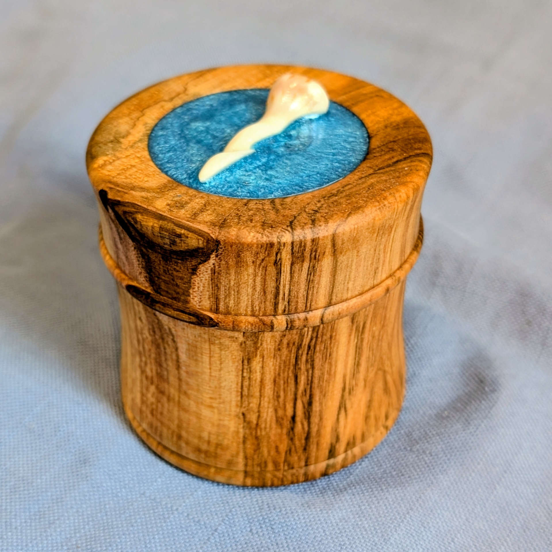 Spalted cherry box with a seashell set into blue resin on the lid
